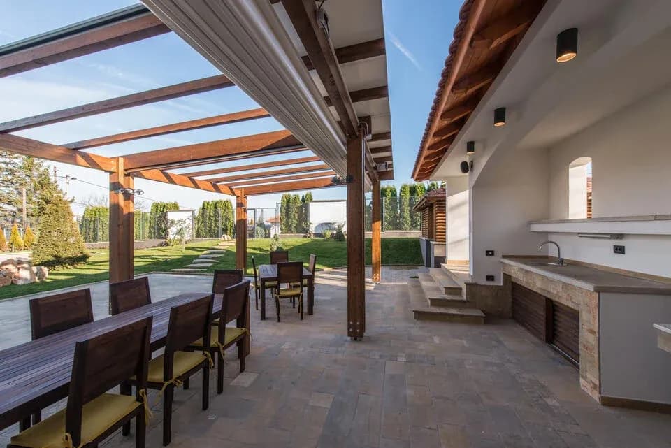 pergola-ideas-pergola-covering-dining-and-outdoor-kitchen-area-off-the-back-of-a-house